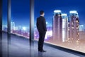 Business man looking the city from his office room Royalty Free Stock Photo