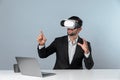 Business man looking at data while sitting and wearing VR glasses. Deviation. Royalty Free Stock Photo