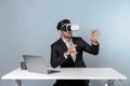 Business man looking at data while sitting and wearing VR glasses. Deviation. Royalty Free Stock Photo