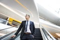 Business Man Looking Escalator Thinking Concept