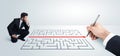 Business man looking at hand drawing solution for maze Royalty Free Stock Photo