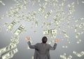 Business man looking at money rain against grey background Royalty Free Stock Photo