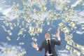 Business man looking at money rain against sky with clouds Royalty Free Stock Photo