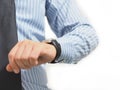 Business man is looking at the wristwatch and white isolated background Royalty Free Stock Photo