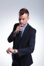 Business man looks at watch Royalty Free Stock Photo