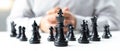 Business men make plans to play chess with Prudence and success