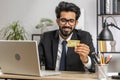 Business man making online purchase payment shopping with credit bank card and laptop at office Royalty Free Stock Photo