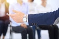 Business man making presentation to group of people. Speaker delivering a seminar to his colleagues or business training Royalty Free Stock Photo