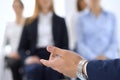 Business man making presentation to group of people. Speaker delivering a seminar to his colleagues or business training Royalty Free Stock Photo