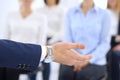 Business man making presentation to group of people. Speaker delivering a seminar to his colleagues or business training Royalty Free Stock Photo