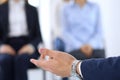 Business man making presentation to group of people. Speaker delivering a seminar to his colleagues or business training Royalty Free Stock Photo