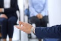 Business man making presentation to group of people. Speaker delivering a seminar to his colleagues or business training Royalty Free Stock Photo