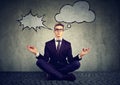 Business man is meditating to relieve stress of busy corporate life Royalty Free Stock Photo