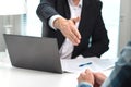 Business man offer and give hand for handshake in office. Royalty Free Stock Photo