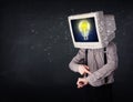 Business man with a pc monitor head and idea light bulb in the d Royalty Free Stock Photo