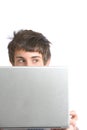 A business man peeking over a modern laptop Royalty Free Stock Photo