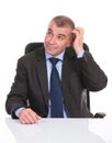 Business man pensive at the desk Royalty Free Stock Photo