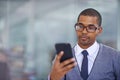 Business man, phone and texting in office for networking, contact and reading for email notification. African person Royalty Free Stock Photo