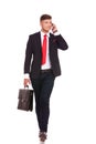 Business man on phone walks Royalty Free Stock Photo