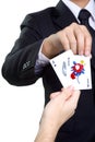 Business man picks card joker in isolated