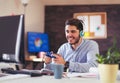 Business man playing videogames in his office