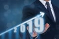 Business man point hand on the top of arrow graph with high rate of growth. The success and growing growth graph in the company or Royalty Free Stock Photo