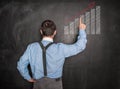 Business man pointing arrow graph on blackboard Royalty Free Stock Photo