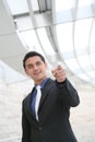 Business Man Pointing with Office Building Royalty Free Stock Photo