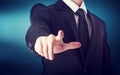 Business man with pointing to something or touching a touch screen Royalty Free Stock Photo