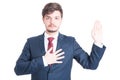 Business man or politician standing raising hand taking oath Royalty Free Stock Photo