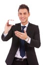 Business man presenting a blank card or note