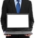 Business man presenting blank laptop