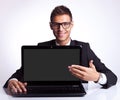 Business man presenting new laptop Royalty Free Stock Photo