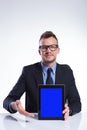 Business man presents his tablet Royalty Free Stock Photo