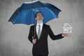 Business man protect your home Royalty Free Stock Photo