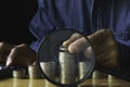 Business man putting  a coin on coins stack saving bank and account for his money all in finance accounting concept Royalty Free Stock Photo