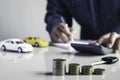 Business man putting a coin on coins stack saving bank and account for his money all in finance accounting concept Royalty Free Stock Photo