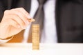 Business man putting stack of coins Royalty Free Stock Photo