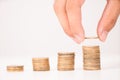 Business man putting stack of coins Royalty Free Stock Photo