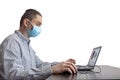 Business Man in quarantine for coronavirus working at his office desk wearing protective face mask. Royalty Free Stock Photo