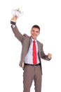 Business man raising trophy Royalty Free Stock Photo