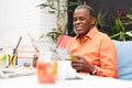 Business man reading the newspaper at a coffee shop Royalty Free Stock Photo