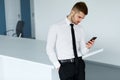 Business Man Reading Something on the Screen of His Cell Phone Royalty Free Stock Photo
