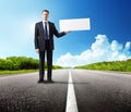 Business man on the road with blank Royalty Free Stock Photo