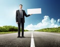 Business man on the road whith blank Royalty Free Stock Photo