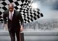 Business man running with briefcase against skyline with sun and checkered flag Royalty Free Stock Photo