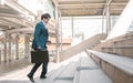 Business man running on steps to work in the morning Royalty Free Stock Photo