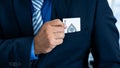 A business man`s hand is holding an ace card out of a suit pocket, at a magic poker show. Gambling concept Royalty Free Stock Photo