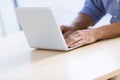 Business man`s hands typing away on laptop computer keyboard. Royalty Free Stock Photo