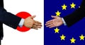 A business man shake each other hand, Japan and EU Royalty Free Stock Photo